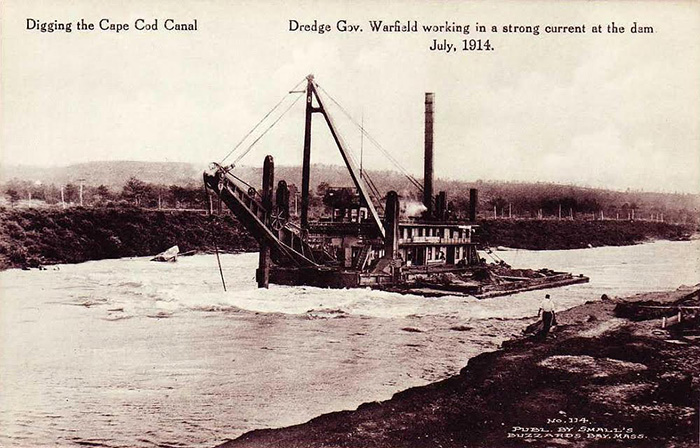 Black and white photo of the Gov. Warfield dredge digging the canal in 1914