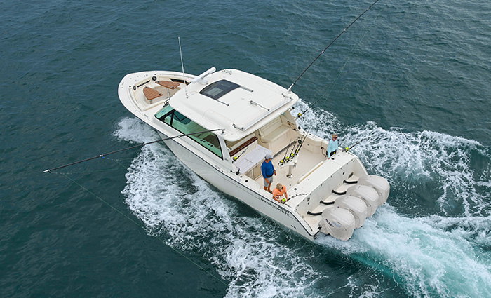 Ariel view of a white vessel out on open waters.