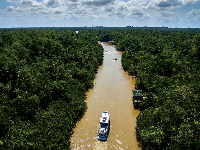 Ariel view of a tour boat traversing the Amazon.