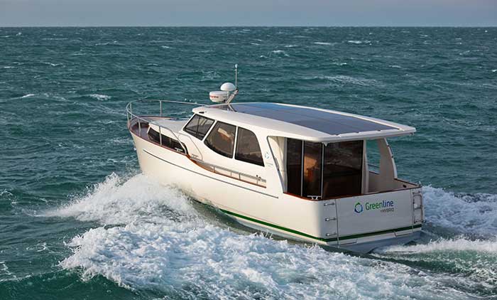 Greenline hybrid powerboat cruising across blue water