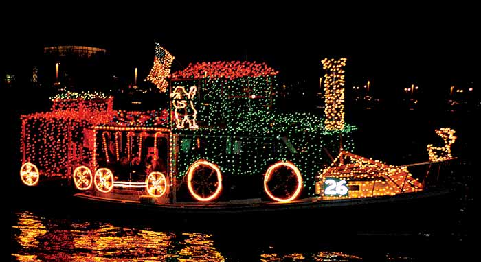 Holiday lights train display in boat parade