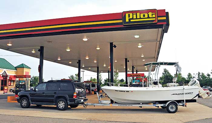 Trailered boat at gas station