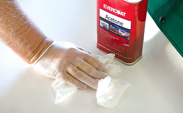 Wiping surface with acetone