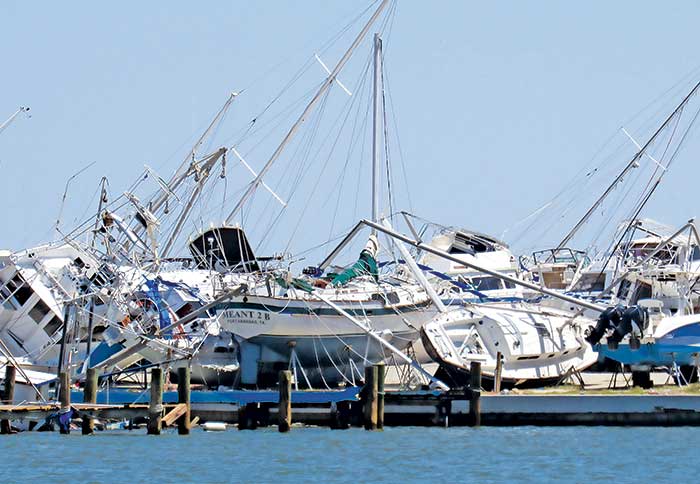 Toppled boats at Rockport Marina