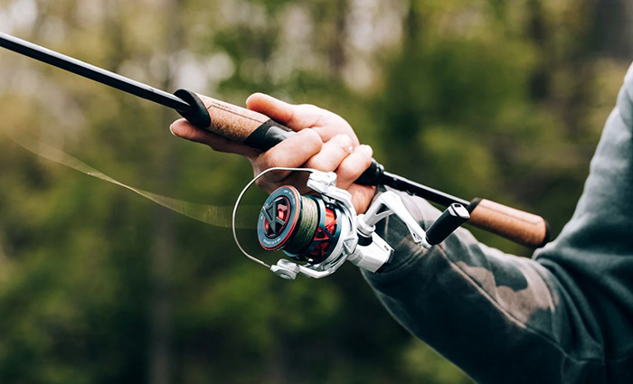 Up close view of a SEVINN fishing reel in use.