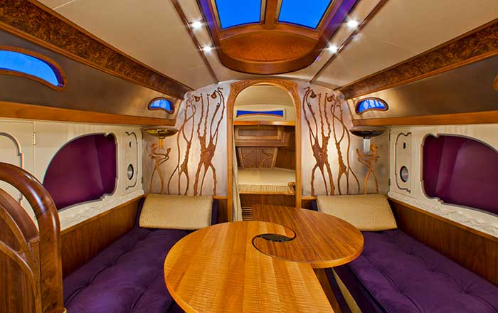 Lionheart's Concerto yacht interior with fancy wood trim and purple carpeting