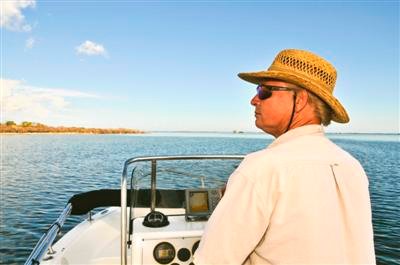 Man Boating with Eye Protection