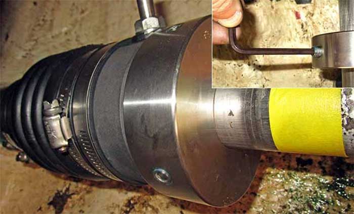 Compress the bellows then clamp rotor to shaft