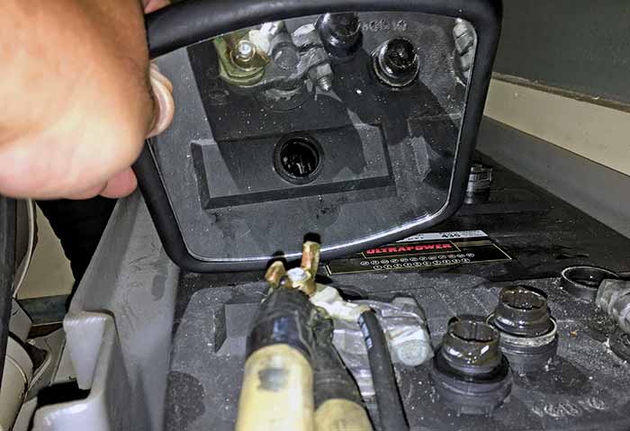 Checking battery with hand-held mirror