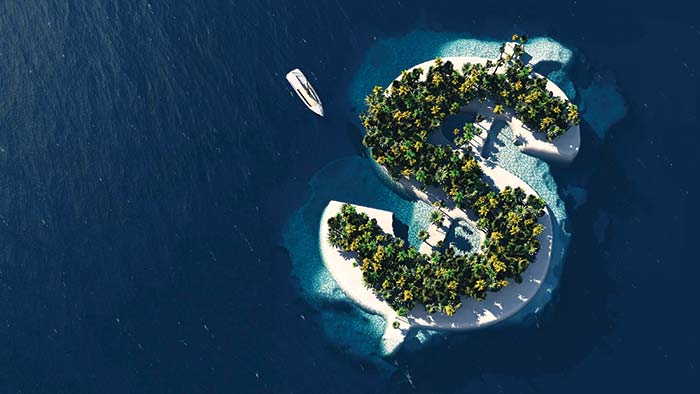 An aerial view of an island in the shape of a dollar sign with a boat pulling up to it