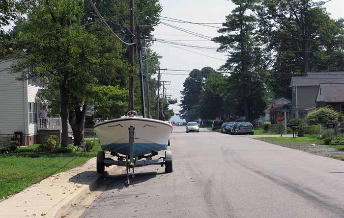 Boat and trailer parked on the street