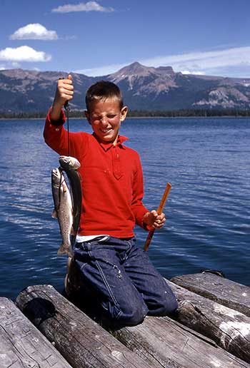 Kid with trout catch