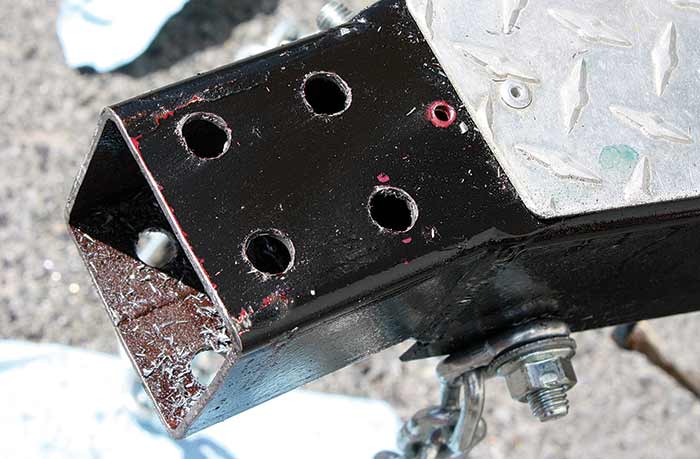 Drill holes for hinge bolts