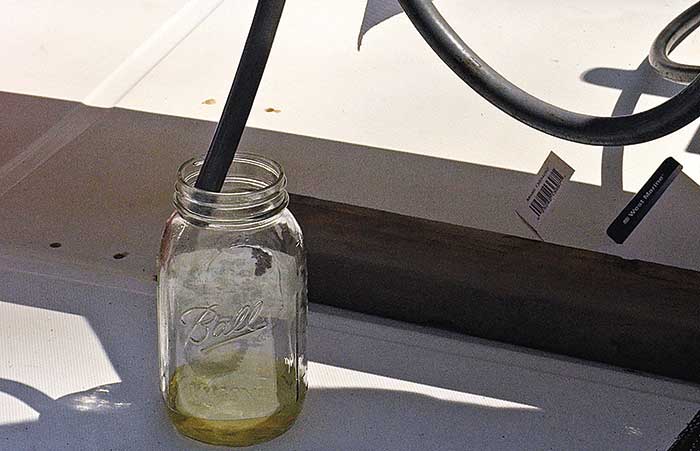 Draining gas into glass jar