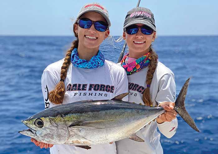 Amanda and Emily Gale with their catch for postings to social media