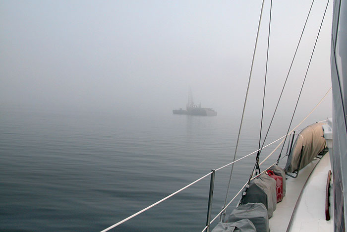 Tug and barge underway in the fog