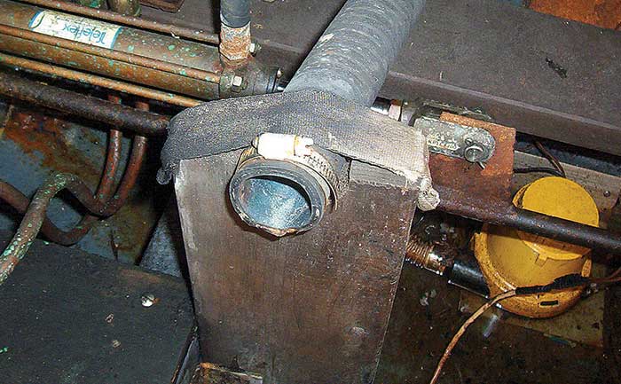 Boat's old exhaust outlet for a generator left uncapped, making boat a sinking hazard