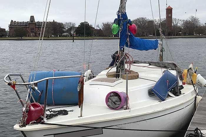 Green and red holiday lights replace proper boat navigation lights on sailboat mast