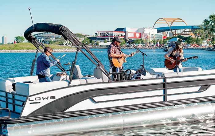 Country music star Rodney Atkins and his band play a concert aboard a Lowe pontoon boat