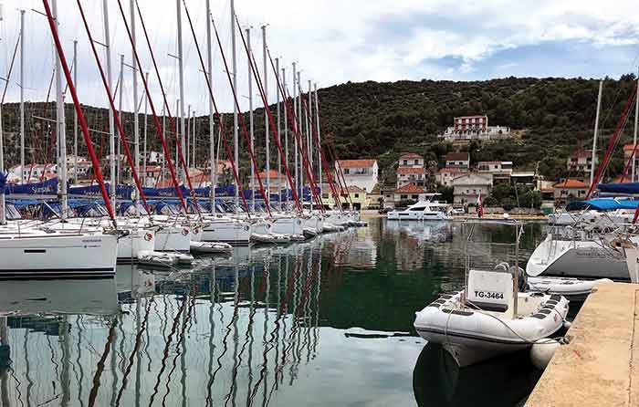Charter boats lined up at a dock at Marina Agana in Croatia
