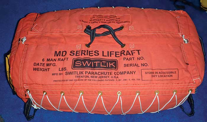Orange life raft package on blue background
