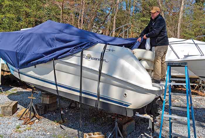 Putting the boat cover on starting from the front