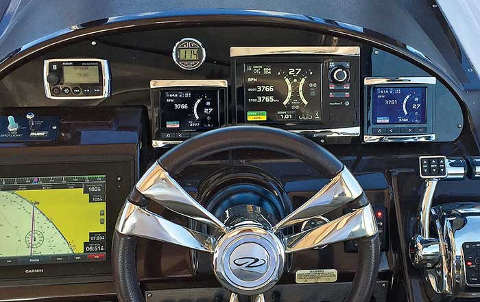 Close-up photo of a new dash panel was outfitted with three VesselView digital screens on a Regal 35 Sports Coup powerboat
