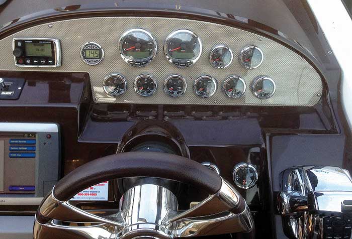 Close-up photo of a Regal 35 Sport Coup powerboat with old analog gauges