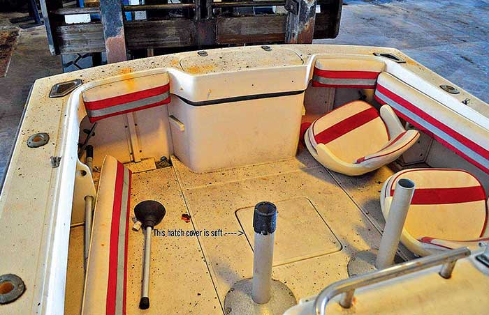 Close up photo of the inside of the aft deck of a center-console powerboat under renovation