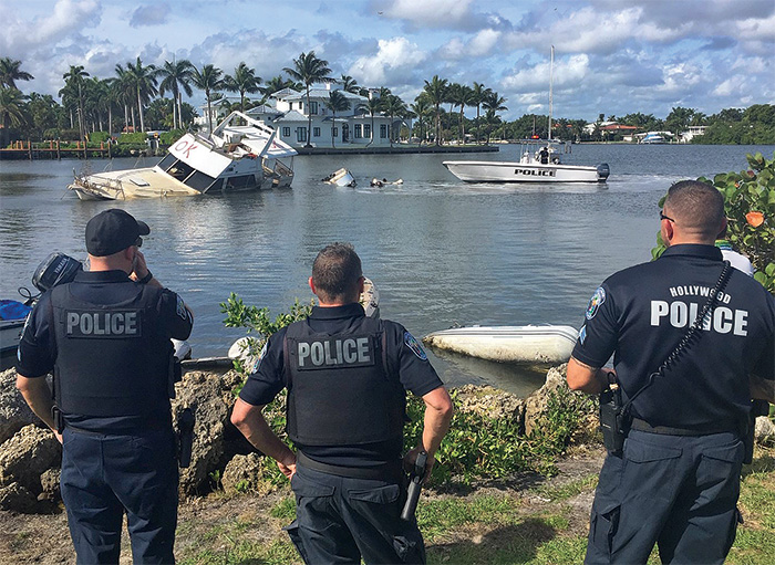 Three local law enforcement officers responding to an at-risk vessel situation