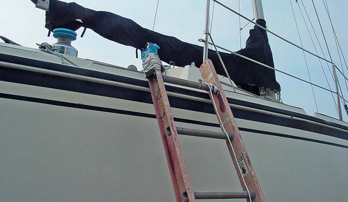 Ladder leaning against side of sailboat