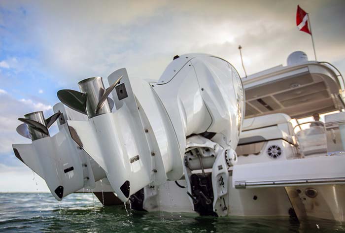 Three Yamaha F450 XTO Offshore outboard engines tilted in the upward position