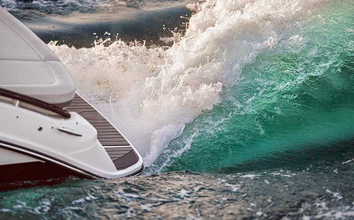 Close up of stern of a Sea Ray SLX 260 with the wake surf option running