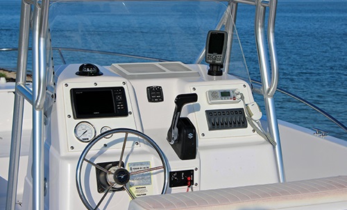 Refurbished and technically upgraded boat steering console out in the open waters on a sunny day
