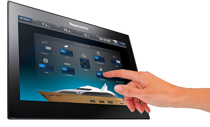 Hand interacting with a Black Raymarine hybridtouch and adjusting the exterior controls.