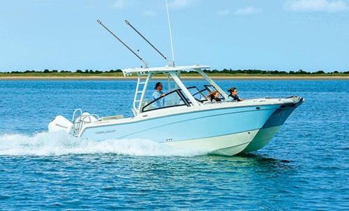 Three adults aboard a Blue and white World Cat 260 DC-X vessel out on the water.